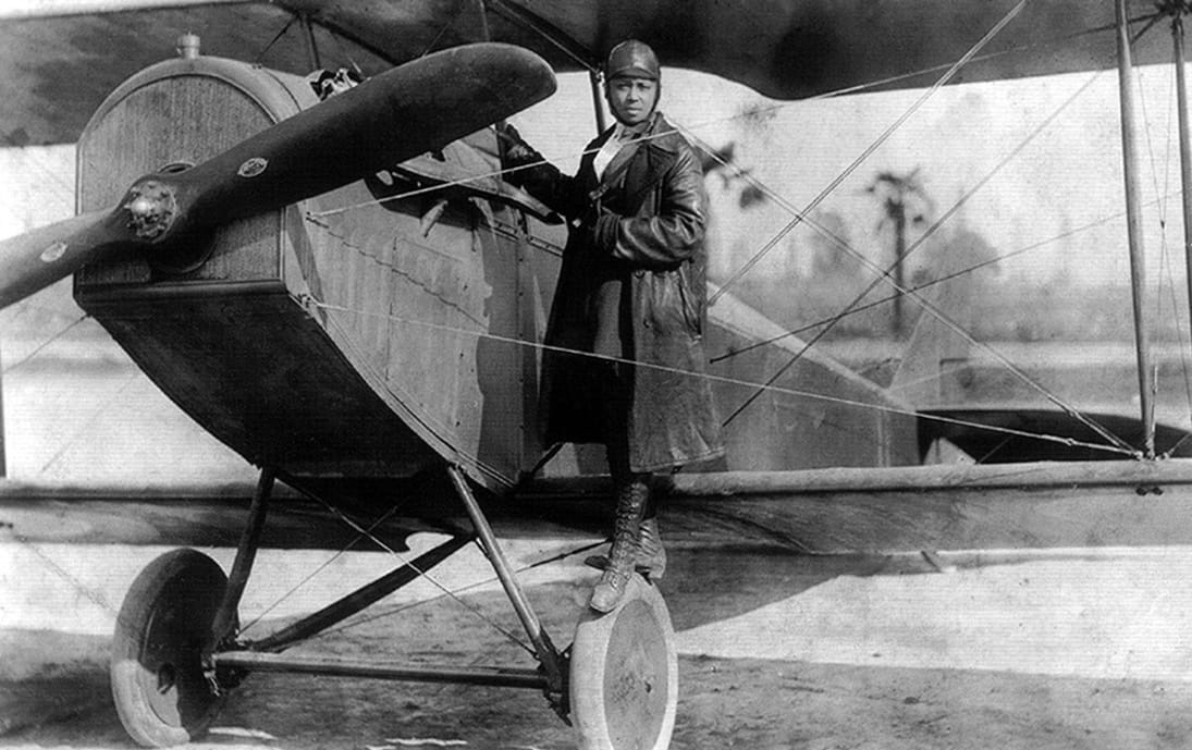 Bessie Coleman with her plane in 1922