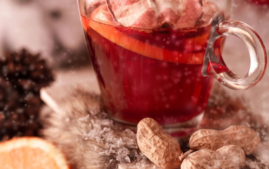 Festive Glühwein (mulled wine) with spiced fruit and cinnamon