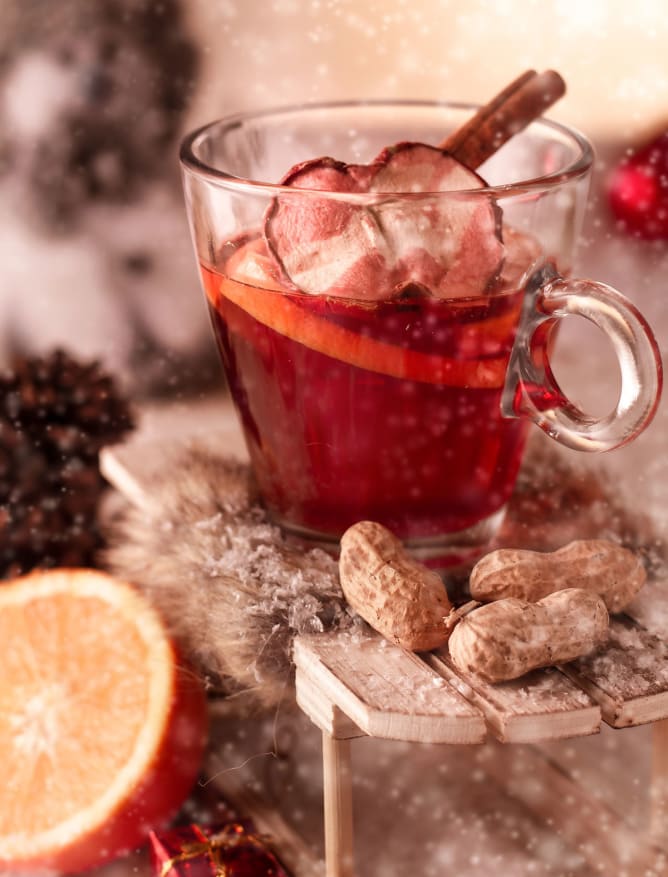 Festive Glühwein (mulled wine) with spiced fruit and cinnamon