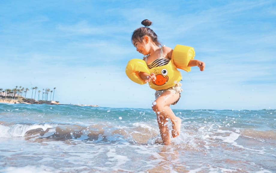 Little girl splashing in sea